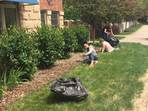 Volunteers complete yard work for Hope Lodge