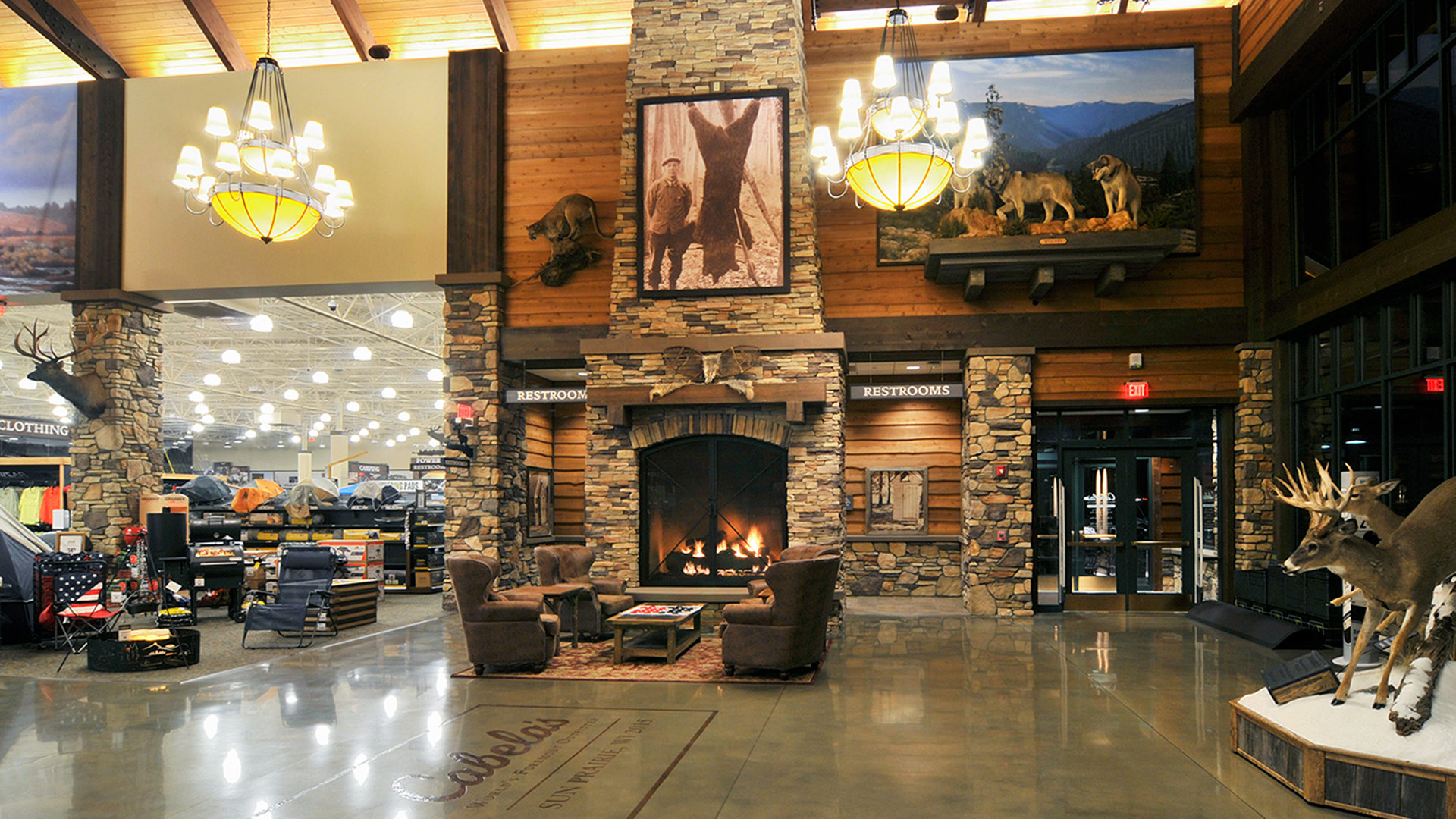 Testimonial Cabelas Retail Center Sun Prairie WI Interior Lobby Seating Area With Leather Chairs in Front of Fireplace
