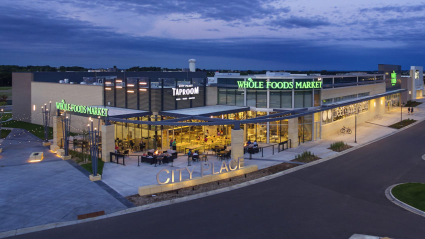 CityPlace Redevelopment Shopping Center Exterior Shot of Bustling Whole Food Market at Dusk