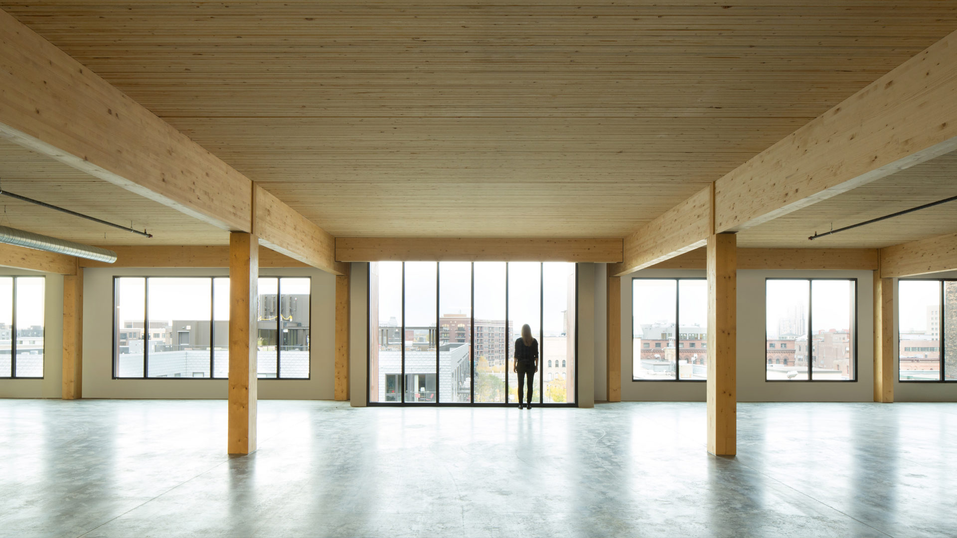 T3 Timber Office Building Minneapolis MN Interior empty Office View Timbers and Cement Floor