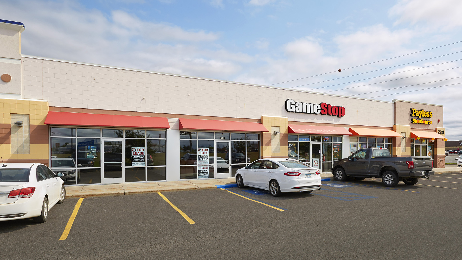 Bemidji Commons Retail Strip Mall Bemidji MN Exterior showing two open bays