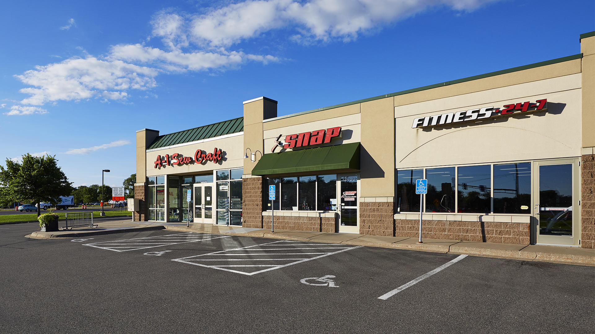 Hayden Lake Square Champlin MN retail shopping center exterior featuring A-1 Sewing and Snap Fitness