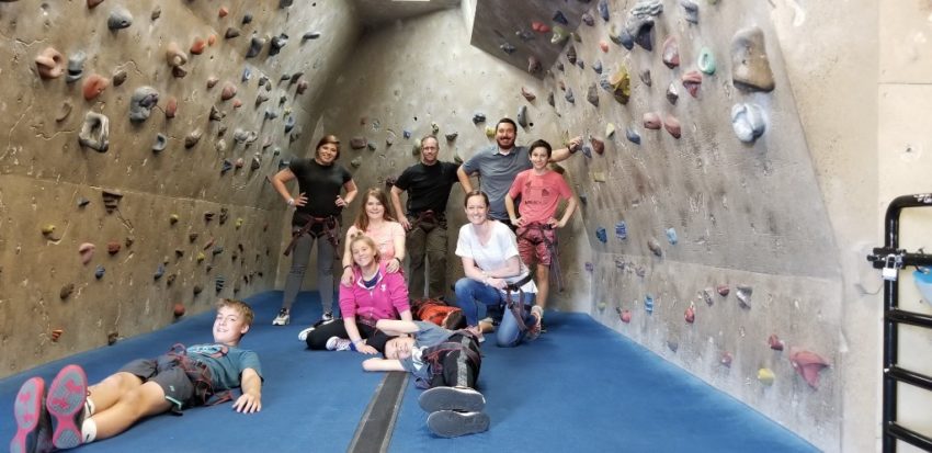 students at rock climbing