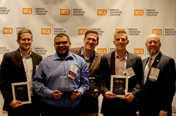 Kraus-Anderson attendees with the awards and event emcee Chad Rettke.