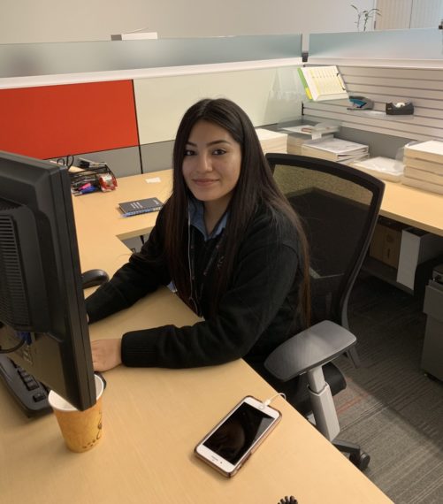 Cristo Rey intern Tania at her desk at KA