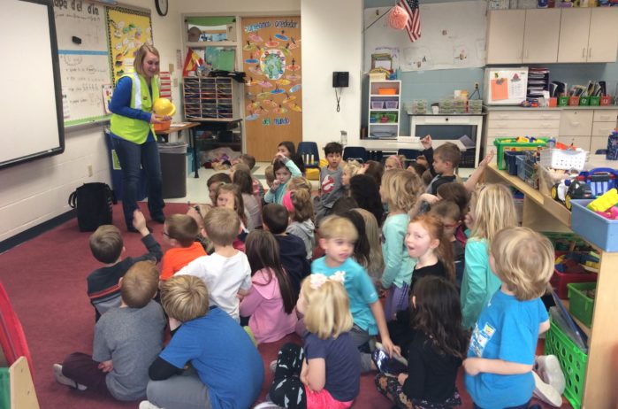 Krystal Burton talks about construction careers with a kindergarten class