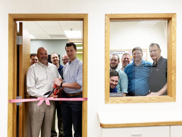 Cutting the ribbon for the KA Bemidji office remodel. 