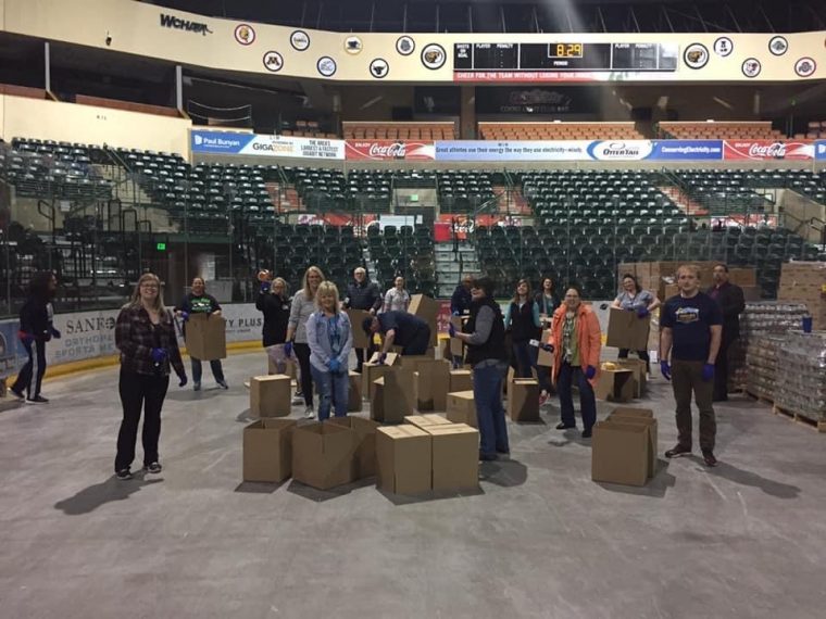 volunteers packing donations
