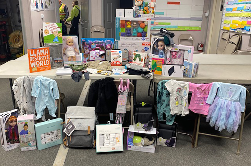 construction workers take up a collection for a military family that recently lost its military parent
