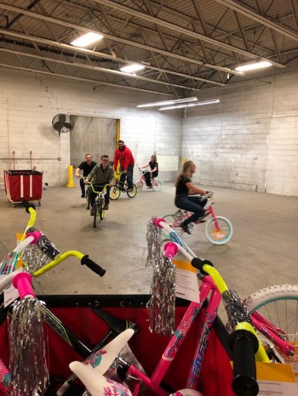 KAers having fun at Toys for Toys Distribution Center