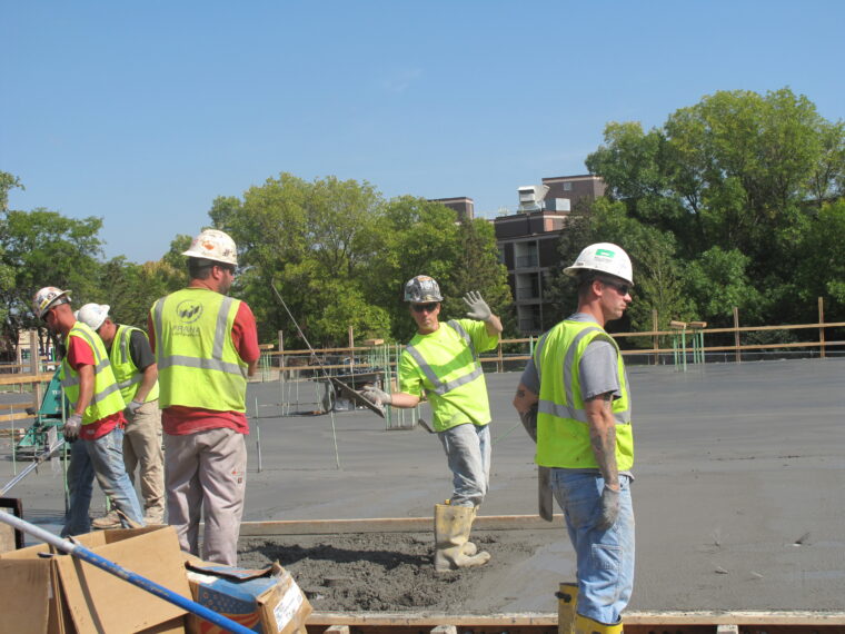 Concrete laborer having fun on the jobsite