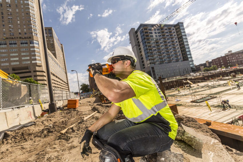 Construction work drinking water on a hot day