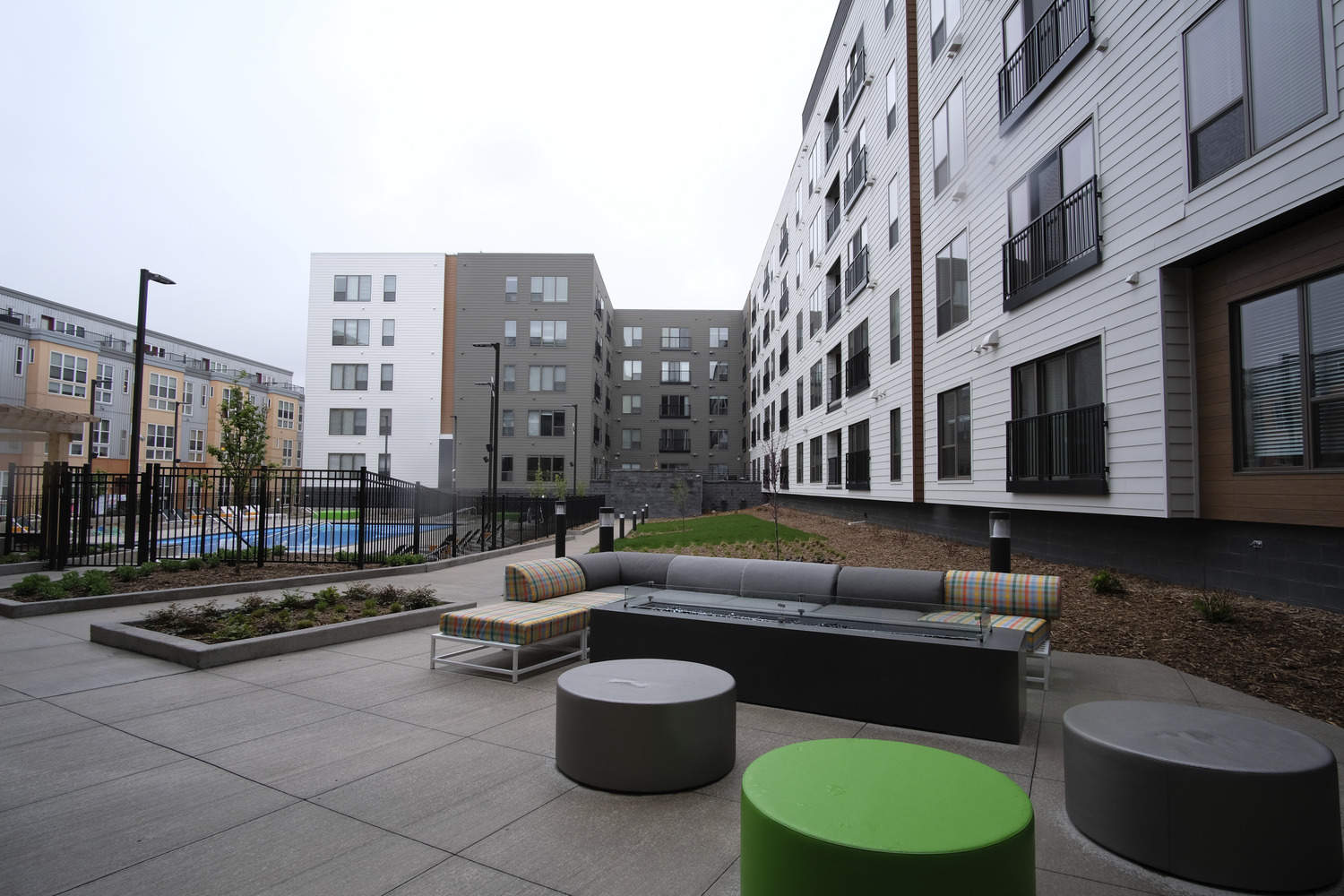 345,482 SF, 248-unit wood framed apartment with precast structure parking