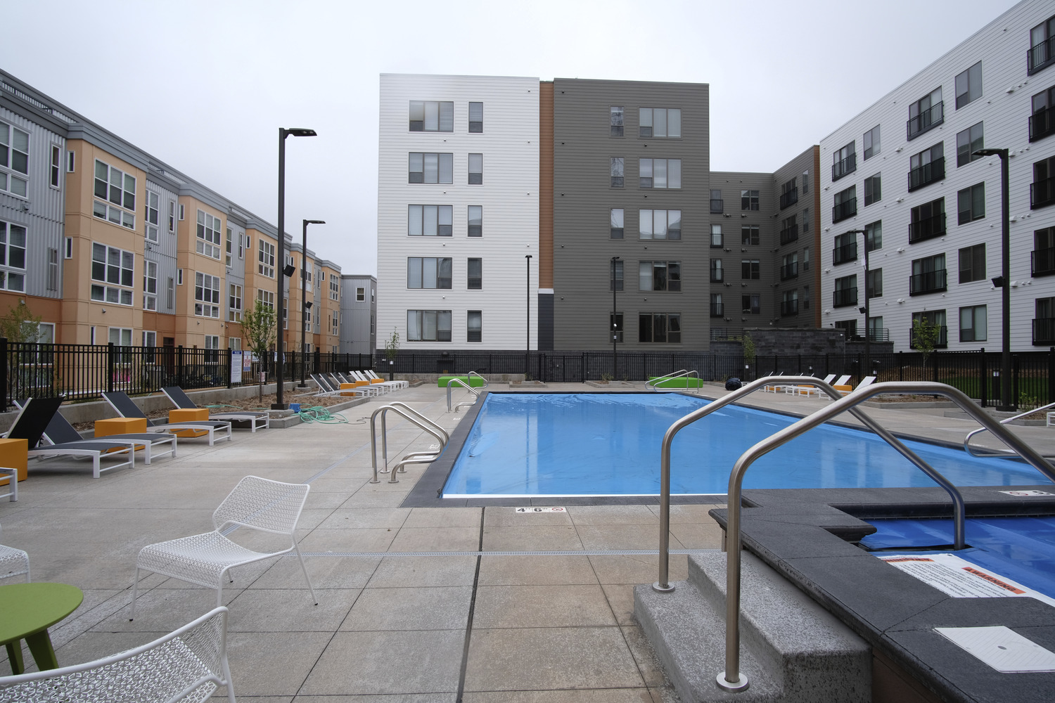 345,482 SF, 248-unit wood framed apartment with precast structure parking