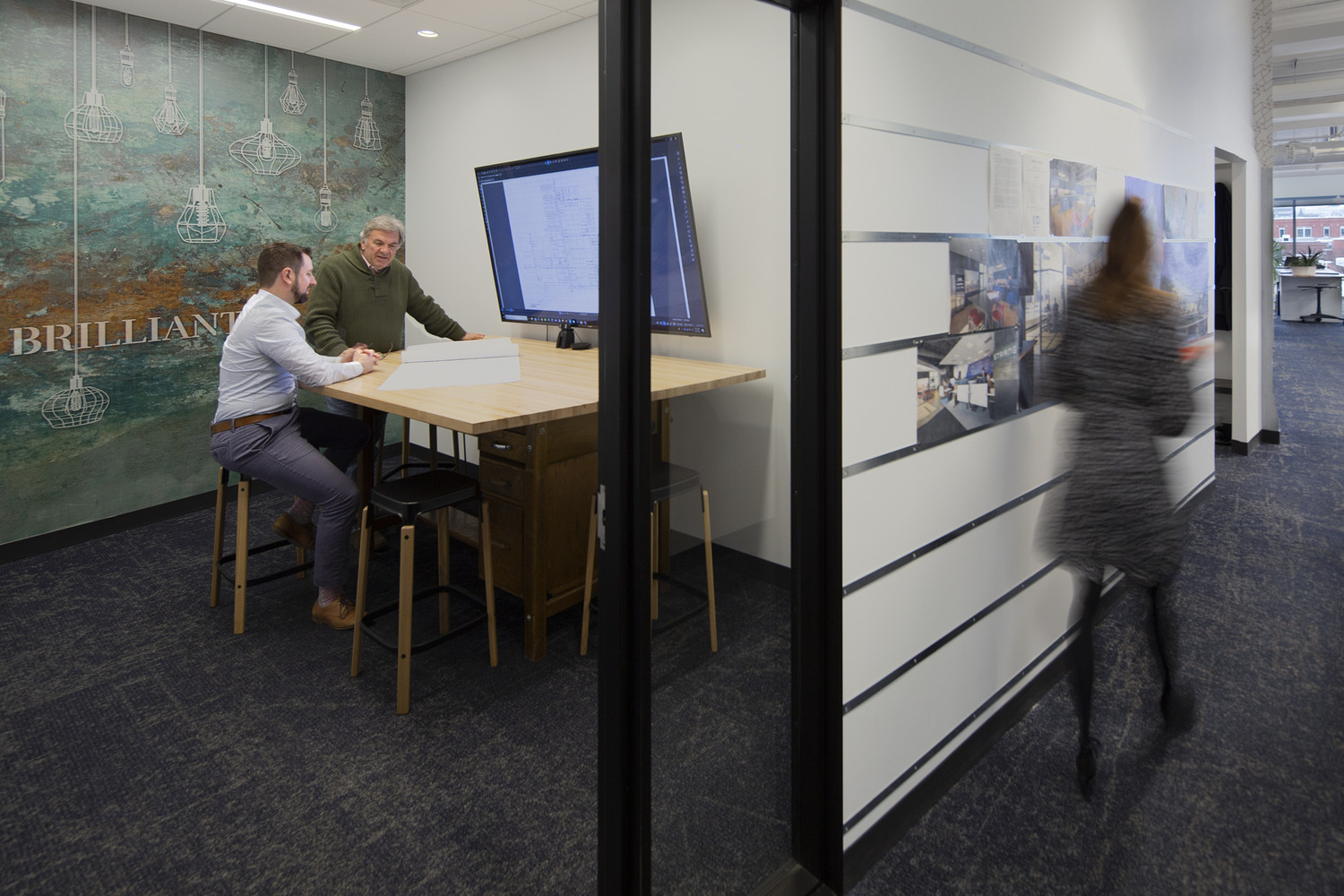 9,000 SF Class A office build out consisting of reception area, conference rooms, work cafe, design lab, work room, and open office areas