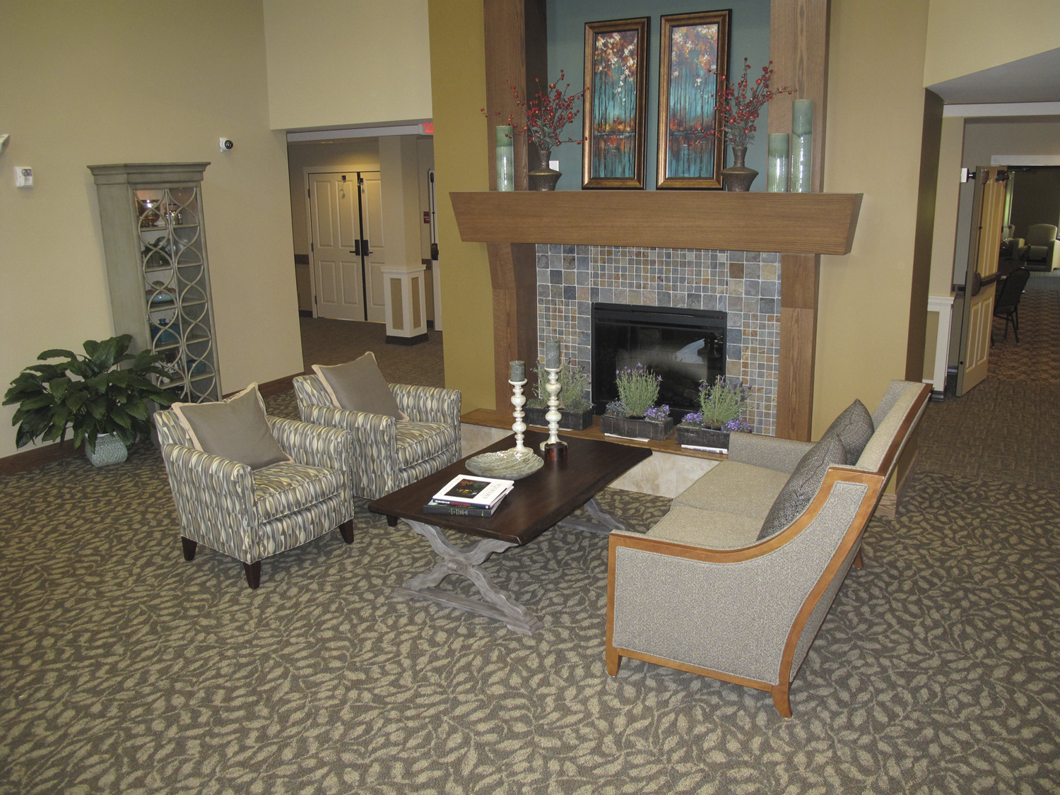 "Arbors II Assisted Living, located in Burnsville and owned by Ebenezer Management Services, is a $12 million, 63-unit Assisted Living building on the Arbors at Ridges campus in Burnsville. The addition to the campus of Arbors II Assisted Living enables Ebenezer to convert an existing building on the campus to Memory Care space. Arbors II Assisted Living brings 63 assisted living units to the five-acre campus at 13897 Community Drive near Fairview Ridges Hospital. Since the completion of Arbors II, residents at an existing 44-unit assisted living building
on the Arbors campus will move in and the older space will be converted to much-needed memory care units. Arbors II Assisted Living includes patios, gardens, a four-season porch, walking paths, a movie theater, library, beauty and barber shop, physical therapy space, a clubroom, dining rooms, chapel, coffee shop, gift shop and lounges. Units at Arbors II include a guest apartment and six “care suites” for post-operative and therapy residents. Jim Beckwith – Project Manager. Sperides Reiners Architects."