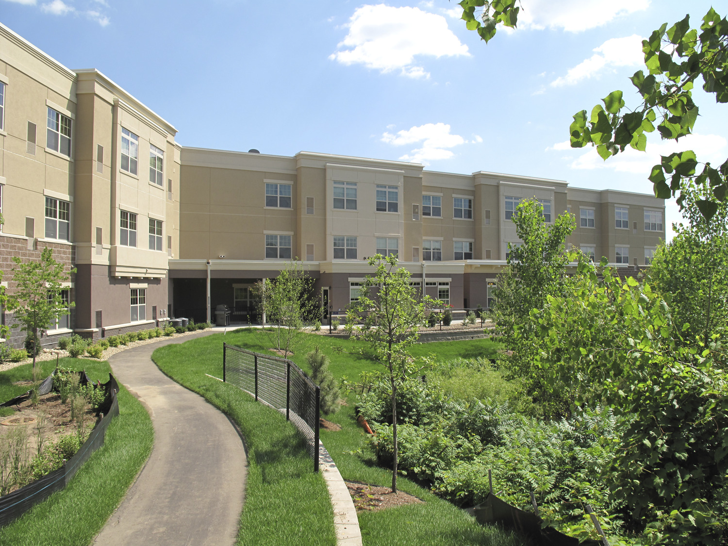 "Arbors II Assisted Living, located in Burnsville and owned by Ebenezer Management Services, is a $12 million, 63-unit Assisted Living building on the Arbors at Ridges campus in Burnsville. The addition to the campus of Arbors II Assisted Living enables Ebenezer to convert an existing building on the campus to Memory Care space. Arbors II Assisted Living brings 63 assisted living units to the five-acre campus at 13897 Community Drive near Fairview Ridges Hospital. Since the completion of Arbors II, residents at an existing 44-unit assisted living building
on the Arbors campus will move in and the older space will be converted to much-needed memory care units. Arbors II Assisted Living includes patios, gardens, a four-season porch, walking paths, a movie theater, library, beauty and barber shop, physical therapy space, a clubroom, dining rooms, chapel, coffee shop, gift shop and lounges. Units at Arbors II include a guest apartment and six “care suites” for post-operative and therapy residents. Jim Beckwith – Project Manager. Sperides Reiners Architects."