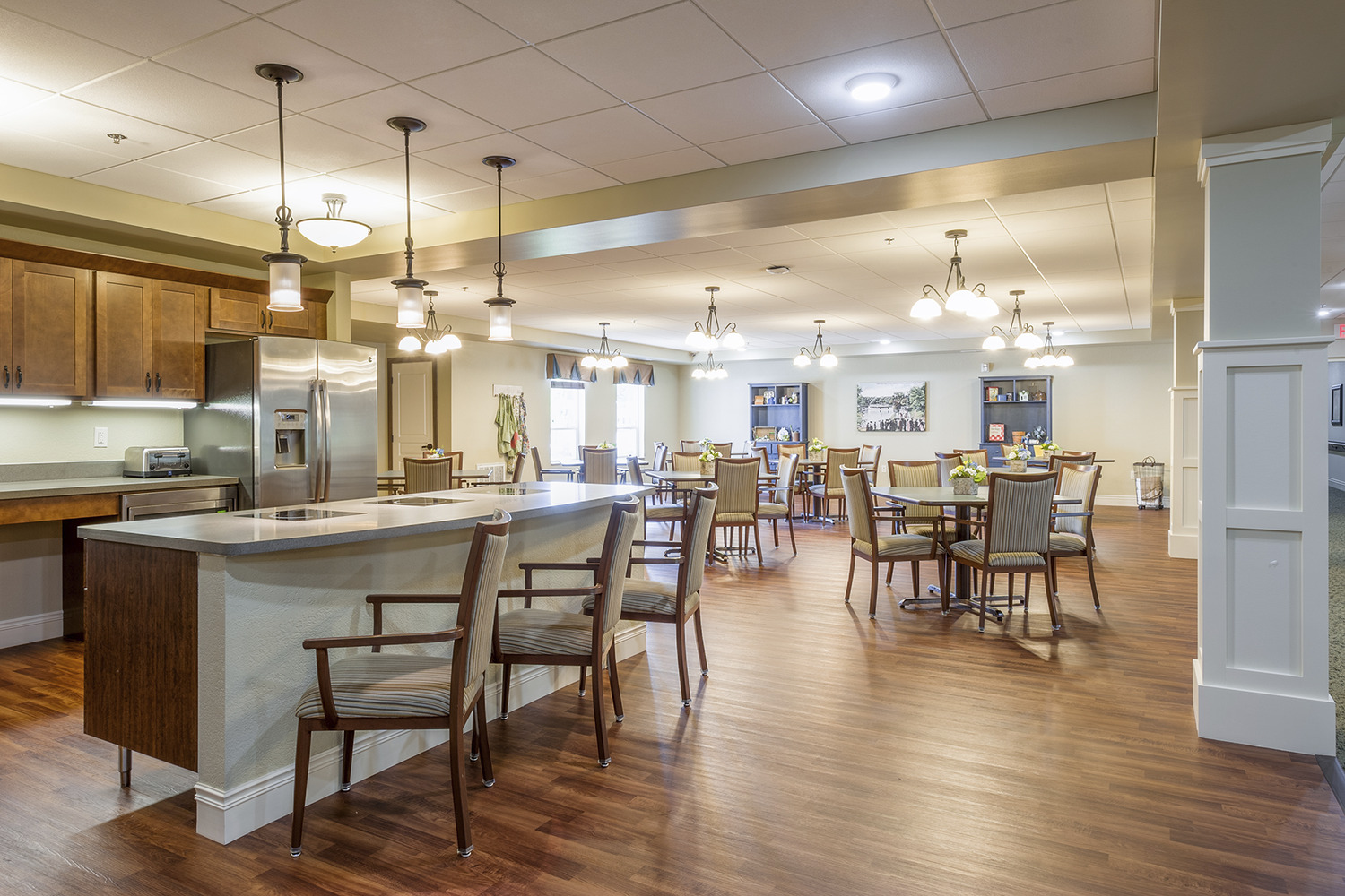 "Deephaven Woods Senior Living, a new senior living community located on the campus of The Church of St. Therese in Deephaven, Minn., has been recently completed. St. Therese Catholic Church partnered with Ebenezer Society to form St. Therese Senior Living, LLC, the joint venture that built Deephaven Woods. 
Deephaven Woods Senior Living fulfills the Church of St. Therese’s desire to further its mission by providing a housing option to the region’s growing senior population. The new senior living community is located on a 14-acre site, part of the church’s 26-acre campus. The two-story development consists of 78 units of independent, assisted living, memory care and Care Suite apartments, and is enhanced by on site amenities including a chapel, heated underground parking garage, an expansive two-story lobby, and outdoor patios, porches, gardens and walking paths. Deephaven Woods Senior Living offers everything seniors need for active, carefree senior living today, with the assurance of care for the future."
