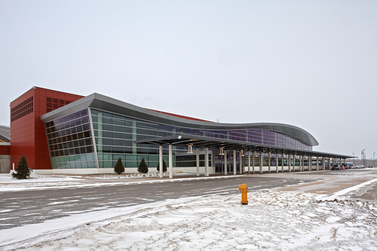 "114,000 s.f. new passenger terminal structure and enclosure, and associated sitework. Reynolds, Smith and Hill."