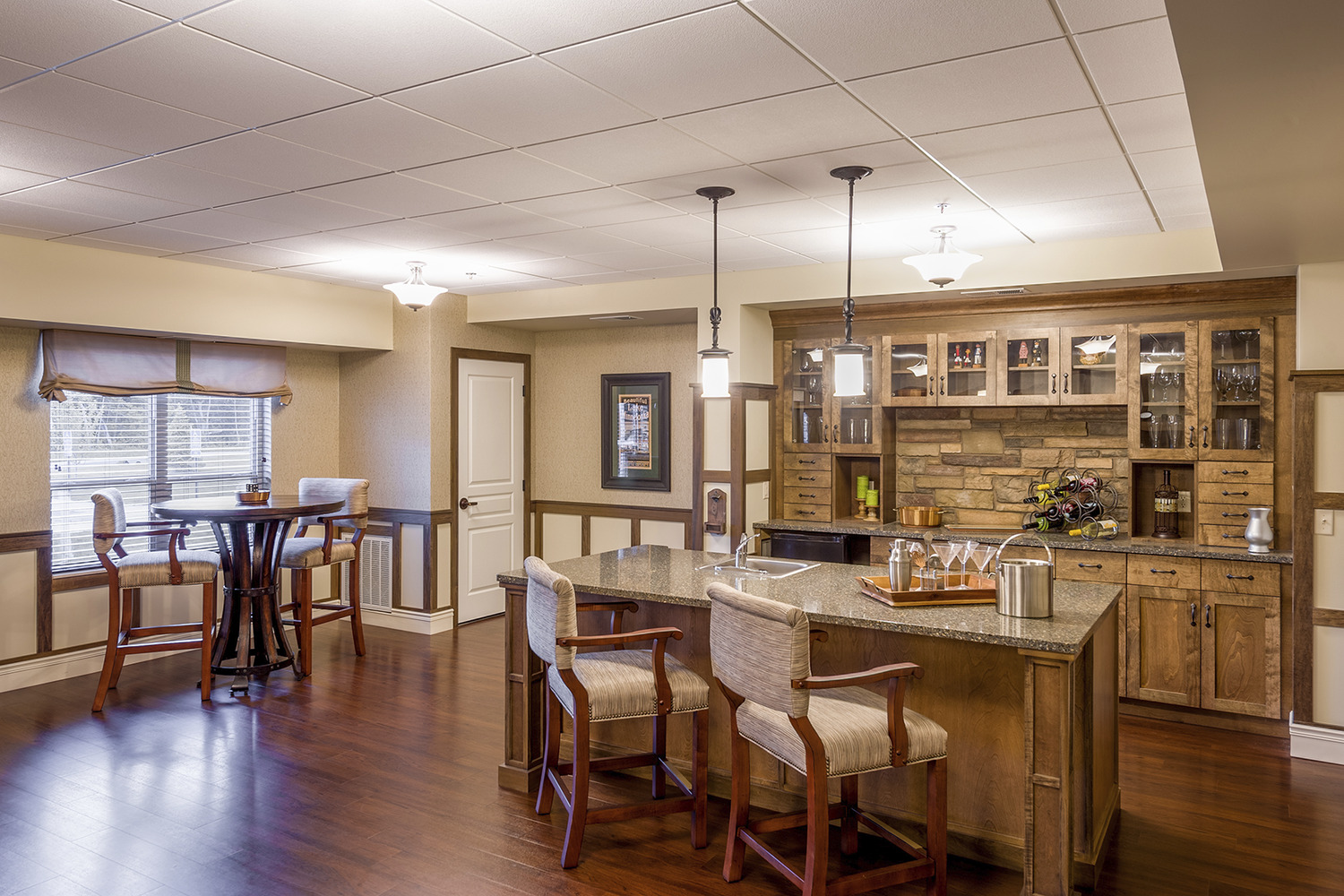 "Deephaven Woods Senior Living, a new senior living community located on the campus of The Church of St. Therese in Deephaven, Minn., has been recently completed. St. Therese Catholic Church partnered with Ebenezer Society to form St. Therese Senior Living, LLC, the joint venture that built Deephaven Woods. Deephaven Woods Senior Living fulfills the Church of St. Therese’s desire to further its mission by providing a housing option to the region’s growing senior population. The new senior living community is located on a 14-acre site, part of the church’s 26-acre campus. The two-story development consists of 78 units of independent, assisted living, memory care and Care Suite apartments, and is enhanced by on site amenities including a chapel, heated underground parking garage, an expansive two-story lobby, and outdoor patios, porches, gardens and walking paths. Deephaven Woods Senior Living offers everything seniors need for active, carefree senior living today, with the assurance of care for the future."